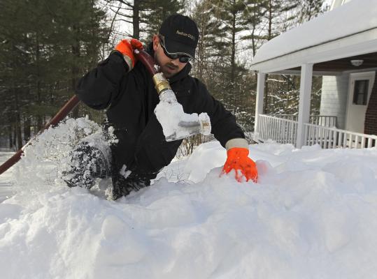 Domino Fuel driver in heavy snow delivering COD heating oil to a Hauppauge home